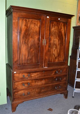 Lot 406 - An early 19th century mahogany linen press