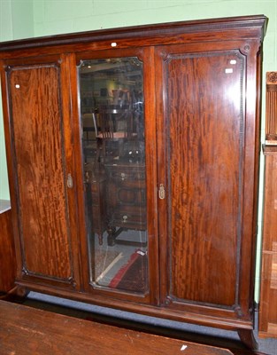 Lot 415 - An Edwardian mahogany triple wardrobe