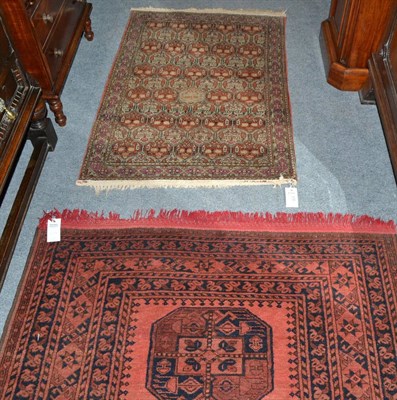 Lot 416 - An Afghan Turkmen rug, north Afghanistan, the terracotta field with five elephant foot guls...