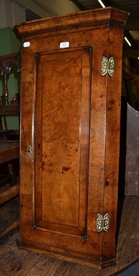 Lot 423 - A small 19th century walnut hanging corner cabinet