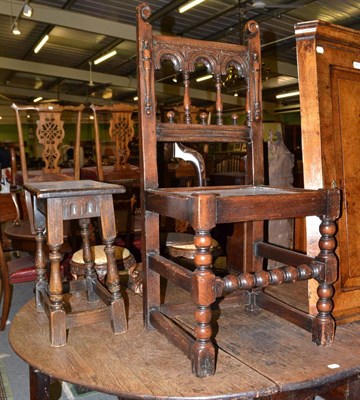 Lot 424 - A 19th century carved oak chair with panelled seat and a carved oak stool