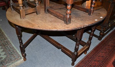 Lot 426 - A 19th century oak gateleg table and a Windsor armchair with crinoline stretcher