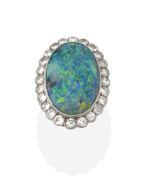 Lot 2256 - An Opal and Diamond Cluster Ring, the oval...