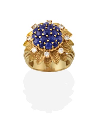 Lot 2316 - A Sapphire and Diamond Cluster Ring, the domed...