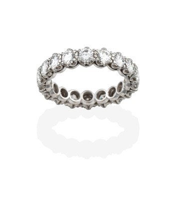 Lot 2377 - A Diamond Eternity Ring, the eighteen round...