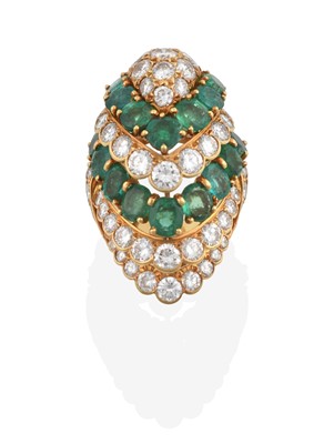 Lot 2310 - An Emerald and Diamond Cluster Ring, the bombé...