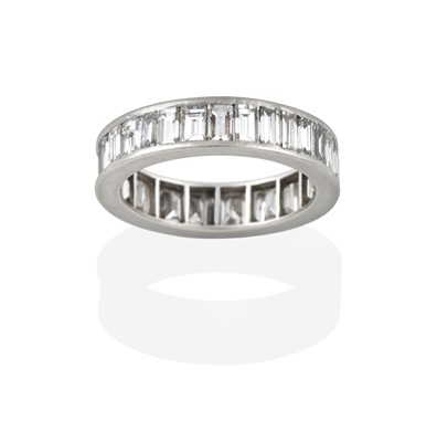 Lot 2394 - A Diamond Eternity Ring, thirty-two baguette...