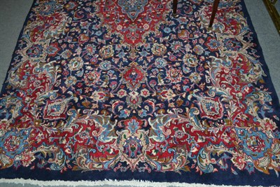 Lot 447 - Kashmar carpet, Khorarsan, the indigo field of palmettes and vines around a pole medallion...