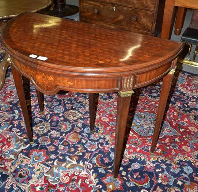 Lot 450 - A Georgian mahogany D-shaped card table