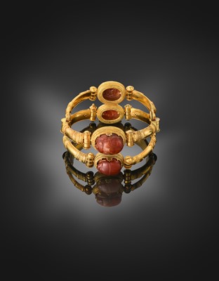 Lot 2396 - An Archaeological Revival Style Scarab Bangle,...