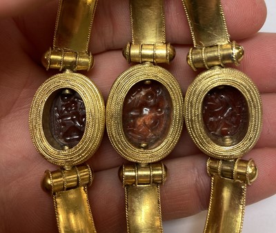 Lot 2396 - An Archaeological Revival Style Scarab Bangle,...