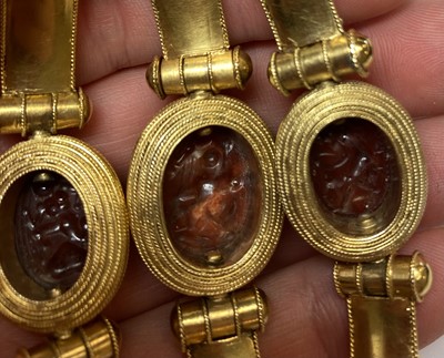 Lot 2396 - An Archaeological Revival Style Scarab Bangle,...