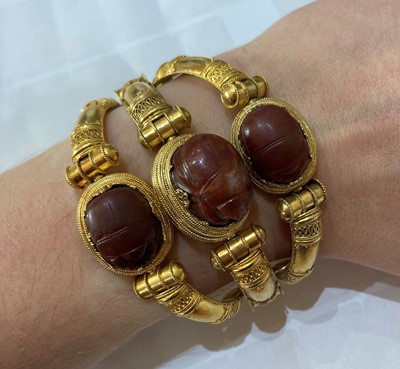 Lot 2396 - An Archaeological Revival Style Scarab Bangle,...