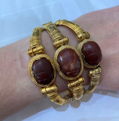 Lot 2396 - An Archaeological Revival Style Scarab Bangle,...