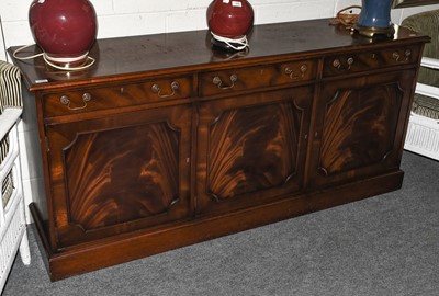 Lot 1255 - A reproduction mahogany sideboard fitted with...