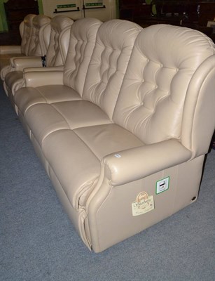 Lot 480 - A Sherbourne cream leather three seater settee, two seater settee and an electric reclining...