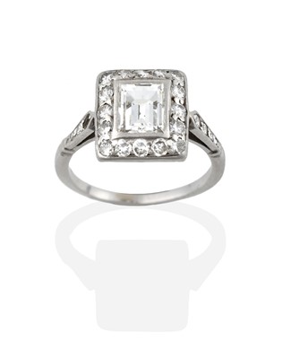 Lot 2259 - A Diamond Cluster Ring, the step cut diamond...