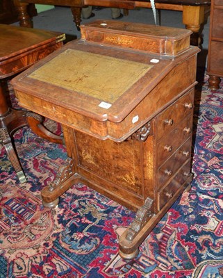 Lot 484 - A Victorian walnut inlaid davenport