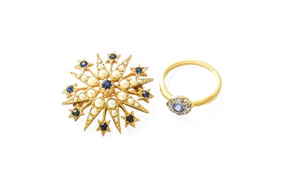 Lot 400 - A Sapphire and Diamond Cluster Ring, the round...