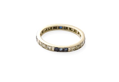 Lot 315 - A Sapphire and Diamond Eternity Ring, trios of...