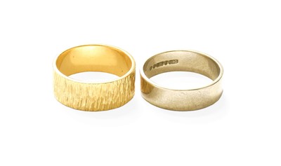 Lot 320 - A 9 Carat Gold Textured Band Ring, finger size...