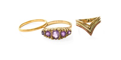 Lot 413 - A 9 Carat Gold Amethyst Five Stone Ring, the...