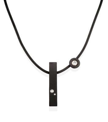 Lot 2292 - A Black Rubber and Diamond Pendant, by Andre...