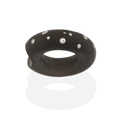 Lot 2293 - A Black Rubber and Diamond Bangle and Ring, by...