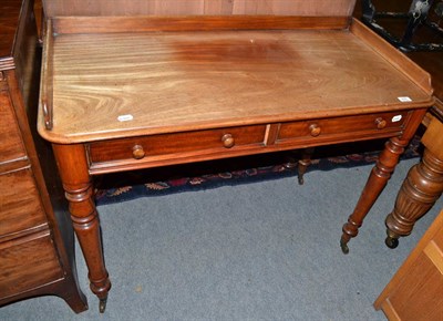 Lot 495 - Victorian mahogany writing table with two drawers