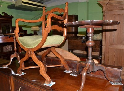 Lot 499 - An oak cross-framed armchair and two occasional tables