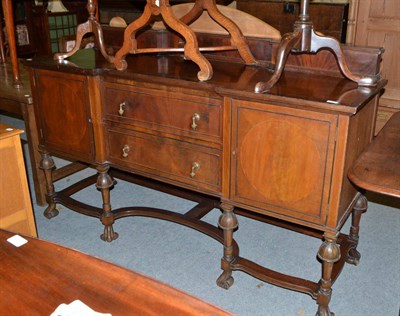 Lot 500 - An Edwardian mahogany breakfront sideboard labelled Maple & Co