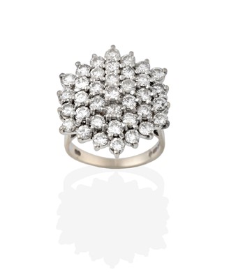 Lot 2370 - An 18 Carat White Gold Diamond Cluster Ring,...