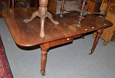 Lot 503 - A Victorian mahogany extending dining table with two leaves