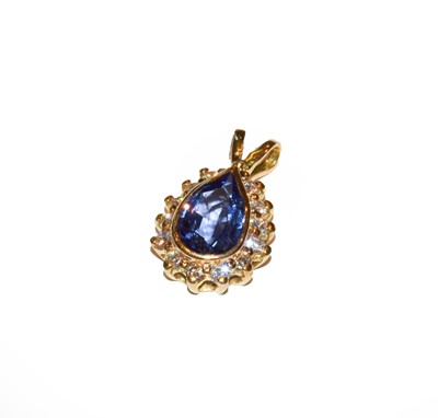 Lot 147 - A tanzanite and diamond cluster pendant, the...