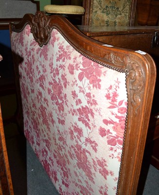 Lot 509 - Continental carved oak double bed with pink floral upholstery