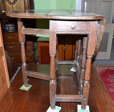 Lot 514 - 19th century oak drop leaf table