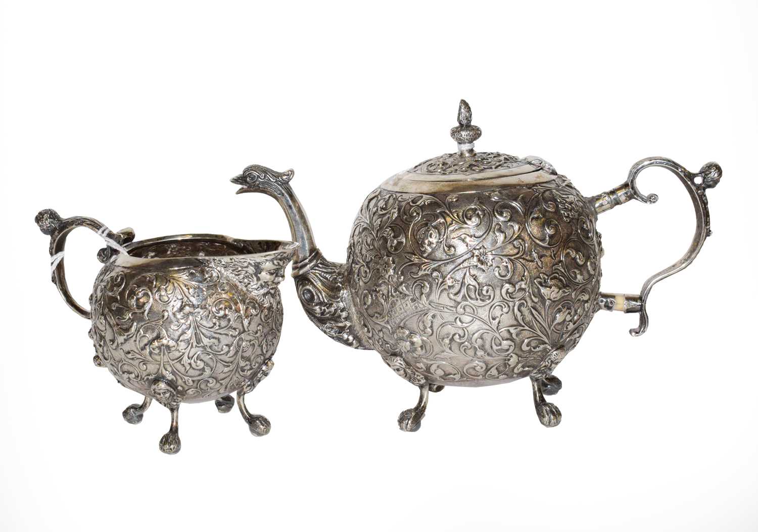 Lot 216 - A Dutch silver teapot and cream jug, maker's...