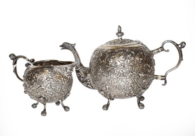 Lot 216 - A Dutch silver teapot and cream jug, maker's...