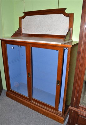 Lot 520 - Oak bookcase with sliding glazed doors and a marble top (for a washstand)