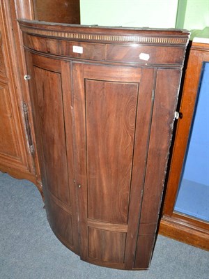 Lot 521 - George III mahogany bow fronted corner cabinet