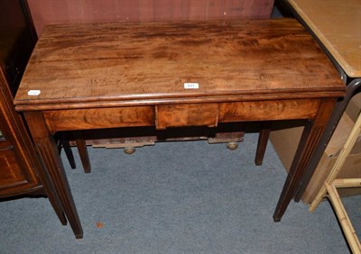 Lot 531 - A Georgian mahogany fold-over games table