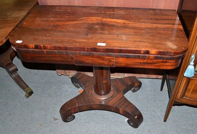 Lot 533 - A 19th century rosewood fold-over tea table