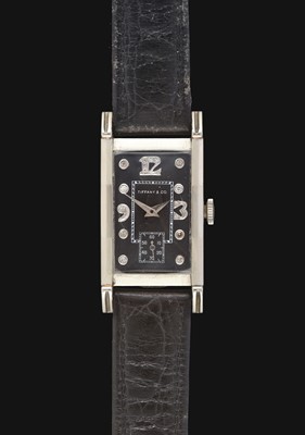 Lot 2182 - A 14 Carat Gold Rectangular Curved Wristwatch...