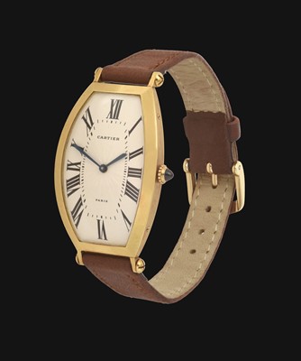 Lot 2243 - A Rare Tonneau Shaped 18 Carat Gold Wristwatch,...