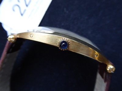 Lot 2102 - Cartier: A Rare Tonneau Shaped 18 Carat Gold Wristwatch