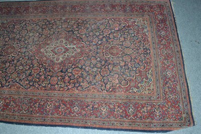 Lot 540 - A Kashan rug, central Persia, the indigo field of vines around a medallion framed by spandrels...