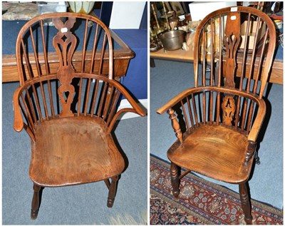 Lot 541 - A yew and elm Windsor armchair and another with crinoline stretcher