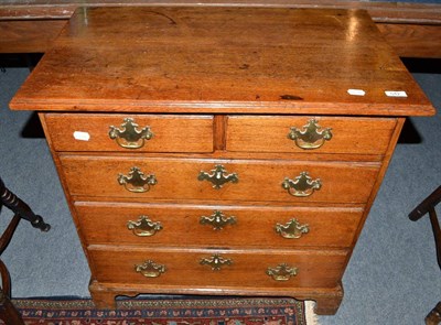 Lot 542 - George III oak chest of small proportions