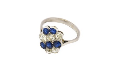 Lot 187 - A synthetic sapphire and diamond cluster ring,...