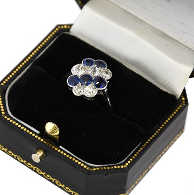 Lot 187 - A synthetic sapphire and diamond cluster ring,...